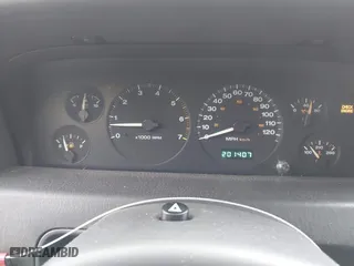 1999 Jeep Grand Cherokee Laredo with VIN 1J4GW58N0XC748809, listed as a IAAI auction lot 41722910 with 201,407 mi miles. Bid and sale history available at carsss.com. Image 7.