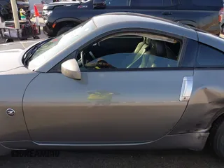 2003 Nissan 350Z Touring with VIN JN1AZ34E73T004666, listed as a IAAI auction lot 41877847 with 260,867 mi miles. Bid and sale history available at carsss.com. Image 14.