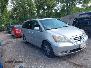 2010 Honda Odyssey Touring with VIN 5FNRL3H92AB078107, listed as a IAAI auction lot 42738457 with 206,523 mi miles and . Bid and sale history available at DreamBid. Image 1.