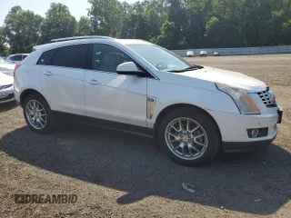 2014 Cadillac SRX Performance Collection with VIN 3GYFNCE38ES629600, listed as a Copart auction lot 61622725 with 86,183 mi miles and Salvage title. Bid and sale history available at DreamBid. Image 4.