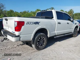 2016 Nissan Titan Platinum Reserve with VIN 1N6BA1F4XGN517905, listed as a IAAI auction lot 42676671 with 110,004 mi miles and . Bid and sale history available at DreamBid. Image 4.