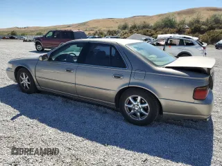 2000 Cadillac Seville Touring STS z VIN 1G6KY5498YU255607, wystawiony jako Copart lot #71130714 z przebiegiem 146 046 mil mil oraz Szkoda całkowita • Salvage title. Historia ofert i sprzedaży dostępna na DreamBid. Obrazek 2.
