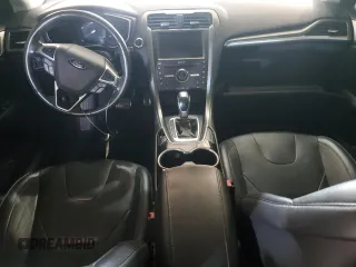 2016 Ford Fusion Titanium z VIN 3FA6P0K96GR117597, wystawiony jako Copart lot #62072525 z przebiegiem Nie podano mil oraz Czysty tytuł • Clean title. Historia ofert i sprzedaży dostępna na DreamBid. Obrazek 8.