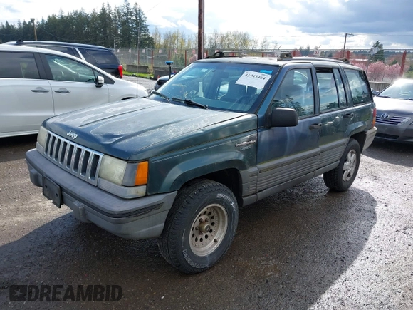 1995 Jeep Grand Cherokee Laredo with VIN 1J4GZ58SXSC676393, listed as a IAAI auction lot 41943464 with 244,317 mi miles. Bid and sale history available at carsss.com. Image 2.