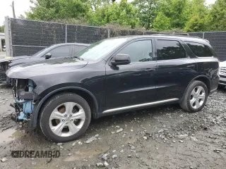 2014 Dodge Durango SXT with VIN 1C4RDJAGXEC354157, listed as a Copart auction lot 57759545 with 184,233 mi miles and Salvage title. Bid and sale history available at DreamBid. Image 1.