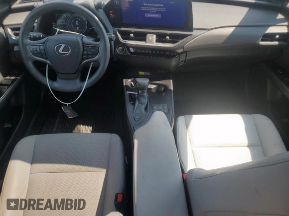 2023 Lexus UX 250h Premium с VIN JTHP9JBHXP2070096, выставлен на аукционе Copart как лот 65645035 с пробегом 9 748 миль миль и Списание • Salvage title. История ставок и продаж доступна на DreamBid. Изображение 8.