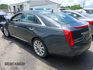 2013 Cadillac XTS Luxury z VIN 2G61P5S34D9109189, wystawiony jako IAAI lot #42242533 z przebiegiem 178 234 mil mil oraz . Historia ofert i sprzedaży dostępna na DreamBid. Obrazek 3.