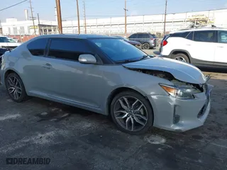 2014 Scion tC with VIN JTKJF5C7XE3079765, listed as a IAAI auction lot 41210220 with 114,410 mi miles. Bid and sale history available at carsss.com. Image 1.