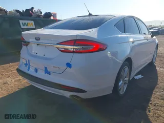 2018 Ford Fusion Hybrid S with VIN 3FA6P0UU0JR204324, listed as a IAAI auction lot 41312303 with 100,527 mi miles. Bid and sale history available at carsss.com. Image 4.