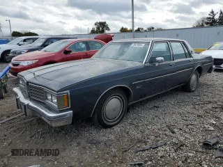 1985 Oldsmobile Delta Royale z VIN 1G3BN69YXF9080322, wystawiony jako Copart lot #78670094 z przebiegiem 58 231 mil mil oraz Tytuł czysty. Historia ofert i sprzedaży dostępna na DreamBid. Obrazek 1.