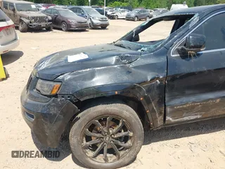 2016 Jeep Grand Cherokee Overland with VIN 1C4RJFCG5GC408390, listed as a IAAI auction lot 42140038 with 140,507 mi miles and . Bid and sale history available at DreamBid. Image 6.