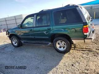 1997 Ford Explorer XL with VIN 1FMDU34E5VZB40878, listed as a Copart auction lot 84009744 with 185,047 mi miles and Salvage title. Bid and sale history available at DreamBid. Image 2.