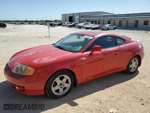 2003 Hyundai Tiburon GT z VIN KMHHN65F53U041351, wystawiony jako Copart lot #52332395 z przebiegiem 194 821 mil mil oraz Czysty tytuł • Clean title. Historia ofert i sprzedaży dostępna na DreamBid. Obrazek 1.