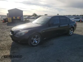 2005 BMW 5 Series 545i with VIN WBANB33565CN65980, listed as a Copart auction lot 52961975 with 143,772 mi miles and Salvage Title. Bid and sale history available at carsss.com. Image 1.