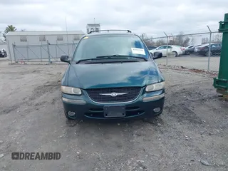 1999 Chrysler Town & Country with VIN 1C4GP54G6XB603564, listed as a IAAI auction lot 41823340 with 104,321 mi miles and . Bid and sale history available at DreamBid. Image 12.