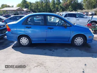 2003 Suzuki Aerio S z VIN JS2RA41SX35171394, wystawiony jako IAAI lot #40612266 z przebiegiem 70 127 mil mil oraz . Historia ofert i sprzedaży dostępna na DreamBid. Obrazek 13.