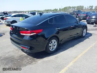 2018 Kia Optima S with VIN 5XXGT4L36JG221671, listed as a IAAI auction lot 41704040 with 136,815 mi miles. Bid and sale history available at carsss.com. Image 4.