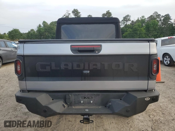 2020 Jeep Gladiator Sport S with VIN 1C6HJTAG9LL127546, listed as a Copart auction lot 54955945 with 99,511 mi miles and Salvage title. Bid and sale history available at DreamBid. Image 6.