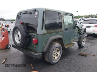 1999 Jeep Wrangler Sport with VIN 1J4FY19S6XP428003, listed as a IAAI auction lot 42149234 with 1 mi miles. Bid and sale history available at carsss.com. Image 4.