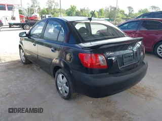 2009 Kia Rio LX with VIN KNADE223496561265, listed as a IAAI auction lot 42143889 with 235,634 mi miles and . Bid and sale history available at DreamBid. Image 3.