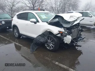 2020 Mazda CX-5 Grand Touring with VIN JM3KFBDMXL0785865, listed as a IAAI auction lot 41567177 with 64,519 mi miles. Bid and sale history available at carsss.com. Image 1.