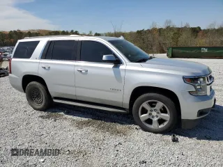 2015 Chevrolet Tahoe LT with VIN 1GNSCBKC9FR741455, listed as a Copart auction lot 50526445 with 157,252 mi miles and Salvage Title. Bid and sale history available at DreamBid. Image 4.