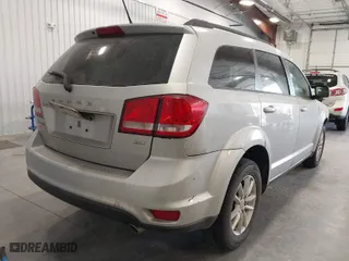 2013 Dodge Journey SXT with VIN 3C4PDCBG4DT720912, listed as a IAAI auction lot 39184206 with 120,147 mi miles. Bid and sale history available at carsss.com. Image 4.