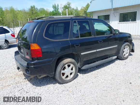 2007 GMC Envoy SLE with VIN 1GKDT13S372103718, listed as a IAAI auction lot 41886111 with 238,423 mi miles. Bid and sale history available at carsss.com. Image 4.