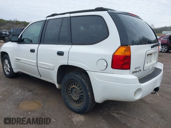 2004 GMC Envoy SLE with VIN 1GKDT13SX42357048, listed as a IAAI auction lot 41601126 with 304,101 mi miles. Bid and sale history available at carsss.com. Image 3.