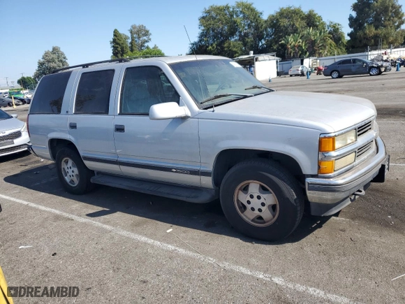 1995 Chevrolet Tahoe with VIN 1GNEK13K6SJ415105, listed as a Copart auction lot 65960124 with 219,821 mi miles and Salvage Title. Bid and sale history available at carsss.com. Image 4.