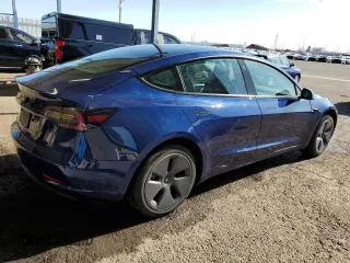 2022 Tesla Model 3 with VIN 5YJ3E1EA9NF288499, listed as a Copart auction lot 52202955 with 86,372 mi miles and Clean Title. Bid and sale history available at DreamBid. Image 3.