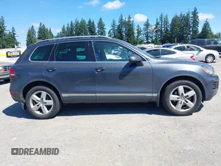 2012 Volkswagen Touareg Sport with VIN WVGFK9BP0CD004951, listed as a IAAI auction lot 42724125 with 173,993 mi miles and . Bid and sale history available at DreamBid. Image 13.