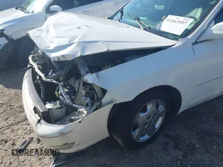 2004 Toyota Avalon XL z VIN 4T1BF28BX4U343188, wystawiony jako IAAI lot #42163107 z przebiegiem Nie podano mil oraz . Historia ofert i sprzedaży dostępna na DreamBid. Obrazek 6.