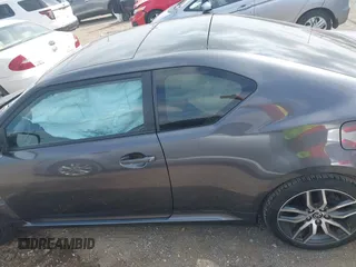 2015 Scion tC z VIN JTKJF5C70FJ013710, wystawiony jako IAAI lot #41770647 z przebiegiem Nie podano mil oraz . Historia ofert i sprzedaży dostępna na DreamBid. Obrazek 14.