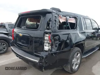 2019 Chevrolet Suburban Premier with VIN 1GNSKJKC7KR261826, listed as a IAAI auction lot 41652451 with 127,032 mi miles and . Bid and sale history available at DreamBid. Image 6.