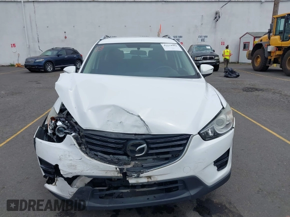 2016 Mazda CX-5 Sport with VIN JM3KE4BY7G0764563, listed as a IAAI auction lot 42279993 with 128,950 mi miles and . Bid and sale history available at DreamBid. Image 12.