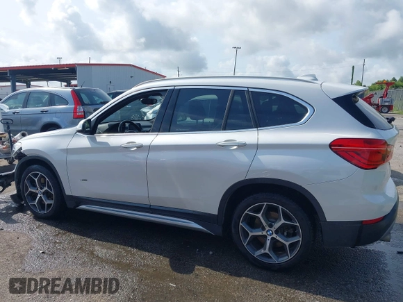 2018 BMW X1 sDrive28i z VIN WBXHU7C34J5H40814, wystawiony jako IAAI lot #42291108 z przebiegiem 93 200 mil mil oraz . Historia ofert i sprzedaży dostępna na DreamBid. Obrazek 14.
