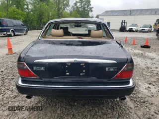 1997 Jaguar XJ with VIN SAJHX6248VC806189, listed as a Copart auction lot 57891035 with 51,654 mi miles and Salvage title. Bid and sale history available at DreamBid. Image 6.