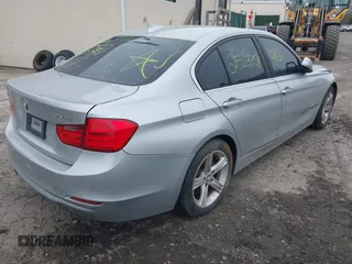 2015 BMW 3 Series 328i xDrive with VIN WBA3B5G57FNS12490, listed as a IAAI auction lot 41927689 with 999,999 mi miles. Bid and sale history available at carsss.com. Image 4.