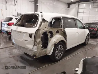 2015 Honda Odyssey Touring Elite with VIN 5FNRL5H92FB020159, listed as a IAAI auction lot 42103240 with 79,322 mi miles and . Bid and sale history available at DreamBid. Image 4.