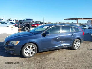 2015 Volvo V60 T5 Drive-E with VIN YV140MEJ8F1261268, listed as a IAAI auction lot 41517740 with 112,991 mi miles. Bid and sale history available at carsss.com. Image 6.