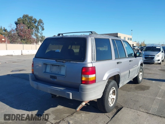 1996 Jeep Grand Cherokee Laredo with VIN 1J4FX58S8TC169575, listed as a IAAI auction lot 40971134 with 152,116 mi miles. Bid and sale history available at carsss.com. Image 4.