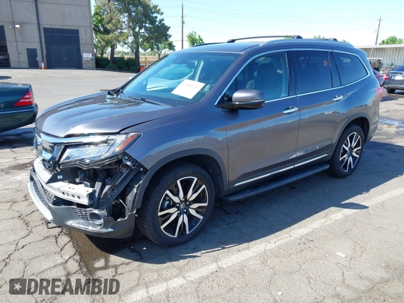 2021 Honda Pilot Touring 8-Passenger with VIN 5FNYF6H97MB034399, listed as a IAAI auction lot 42303419 with 50,034 mi miles and . Bid and sale history available at DreamBid. Image 18.
