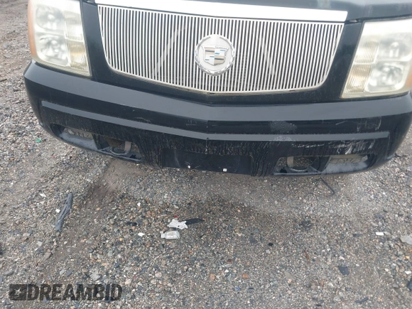 2003 Cadillac Escalade z VIN 1GYEK63N13R140496, wystawiony jako IAAI lot #42366303 z przebiegiem 90 940 mil mil oraz . Historia ofert i sprzedaży dostępna na DreamBid. Obrazek 6.