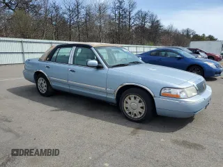 2005 Mercury Grand Marquis GS z VIN 2MEFM74W75X603444, wystawiony jako Copart lot #54395945 z przebiegiem 110 933 mil mil oraz Czysty tytuł • Clean title. Historia ofert i sprzedaży dostępna na DreamBid. Obrazek 4.