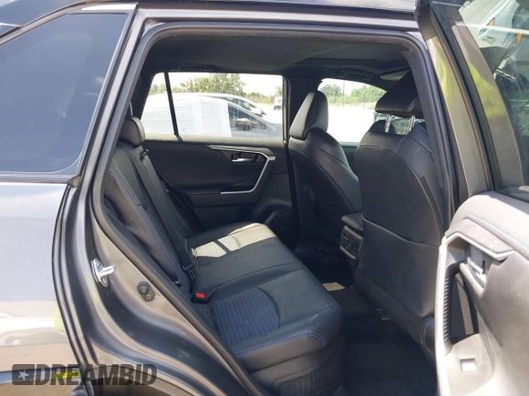 2021 Toyota RAV4 Hybrid XSE with VIN 2T3E6RFV8MW026973, listed as a IAAI auction lot 42052289 with 94,857 mi miles and . Bid and sale history available at DreamBid. Image 8.