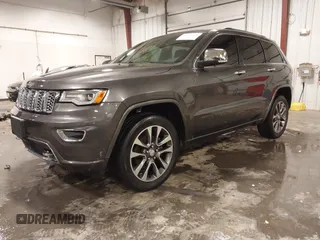 2017 Jeep Grand Cherokee Overland z VIN 1C4RJFCG6HC641812, wystawiony jako IAAI lot #42053404 z przebiegiem 129 184 mil mil oraz . Historia ofert i sprzedaży dostępna na DreamBid. Obrazek 2.