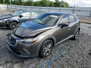 2017 Mazda CX-3 Touring z VIN JM1DKDC71H0172044, wystawiony jako Copart lot #56465125 z przebiegiem 119 374 mil mil oraz Szkoda całkowita • Salvage title. Historia ofert i sprzedaży dostępna na DreamBid. Obrazek 1.