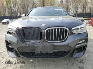 2019 BMW X4 M40i with VIN 5UXUJ5C5XKLJ64004, listed as a Copart auction lot 52106895 with 74,599 mi miles and Salvage title. Bid and sale history available at DreamBid. Image 5.