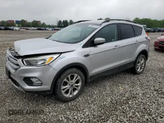 2018 Ford Escape SE z VIN 1FMCU9GD3JUA11093, wystawiony jako Copart lot #57644145 z przebiegiem 161 708 mil mil oraz Szkoda całkowita • Salvage title. Historia ofert i sprzedaży dostępna na DreamBid. Obrazek 1.